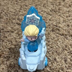 a Fisher-Price Little People Disney Frozen Elsa Parade Float.